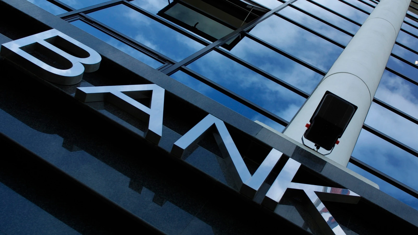 Bank sign on a glass office building
