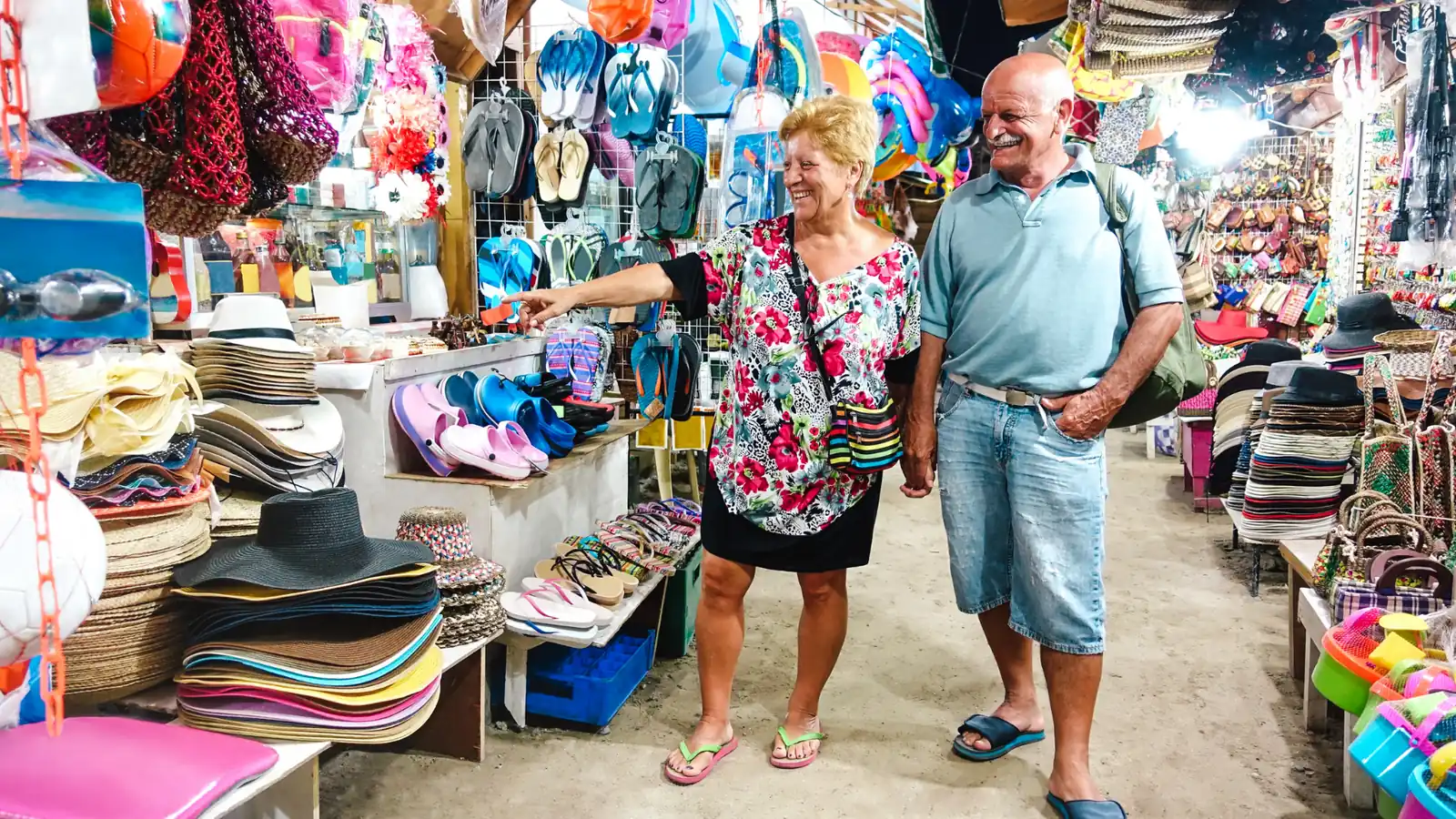 Retired couple shopping at a beach market